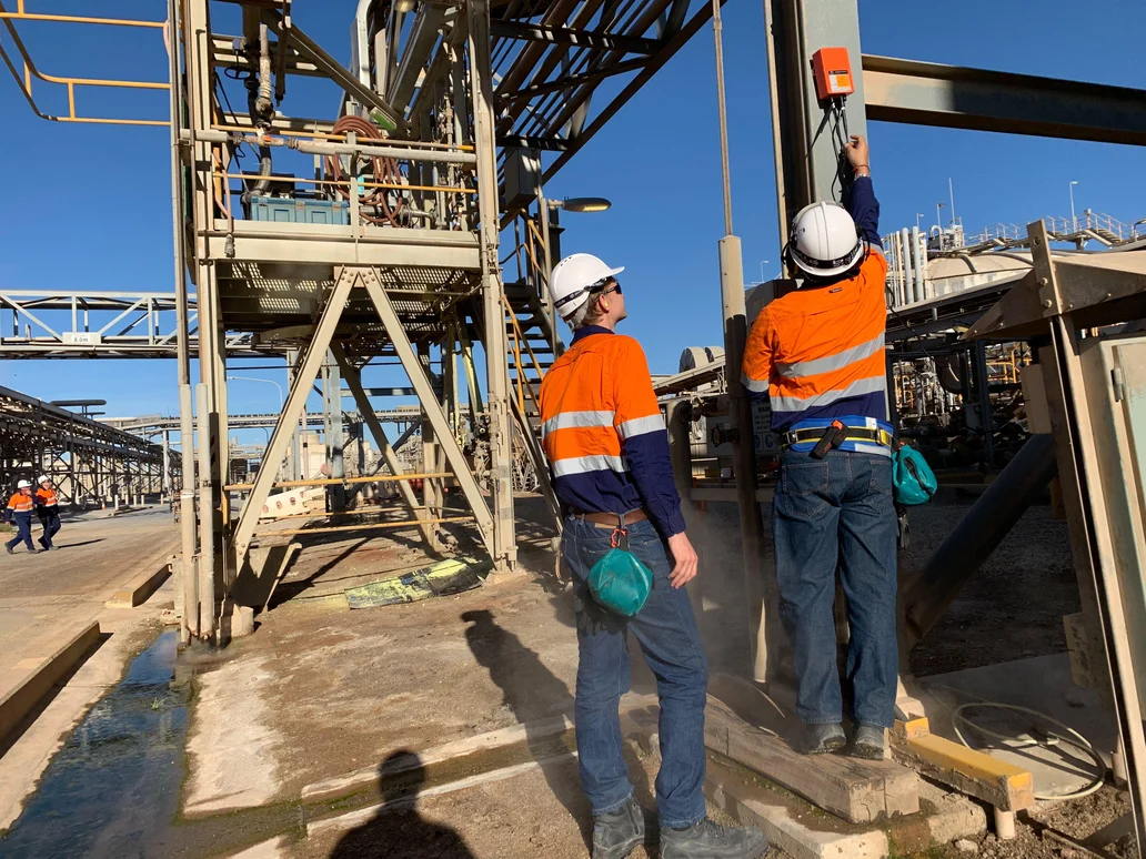 Field team installing connected site technology at an industrial facility